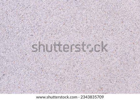 Background abstract or texture. Pebbles small or gravel color yellow, orange attached with beautiful cement concrete. Natural pattern used to make wallpaper website along walls of houses, building.