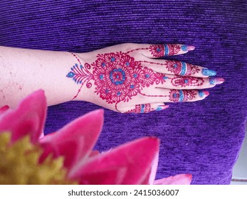 background of art on a hand, brown henna art combined with blue henna