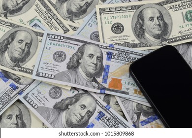 Background Of Banknotes Of $ 100, Old And New Copies And A Cell Phone