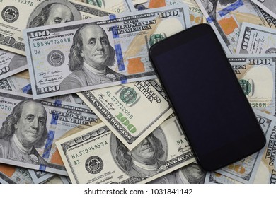 Background Of Banknotes Of $ 100, Old And New Copies And A Cell Phone