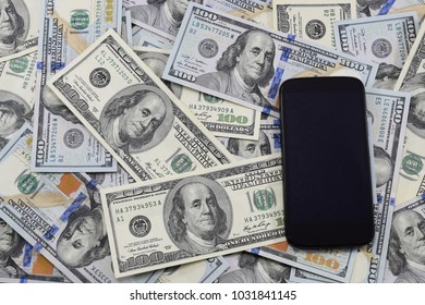 Background Of Banknotes Of $ 100, Old And New Copies And A Cell Phone