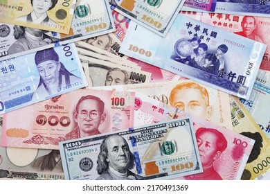 Background of banknotes from different countries. U.S. dollar, Chinese yuan, Japanese yen, Korean won, Thai baht banknotes, etc.