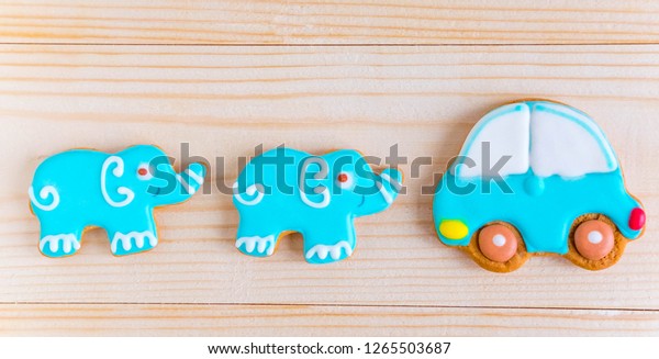 Background for a banner with elephants and\
car. Children banner. Frame for greeting card newborn boy. Blank\
for design childish banner with\
gingerbread.