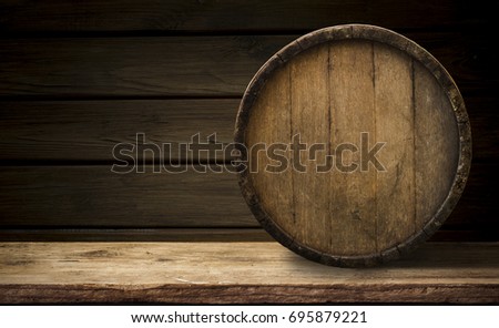 background of barrel and worn old table of wood.