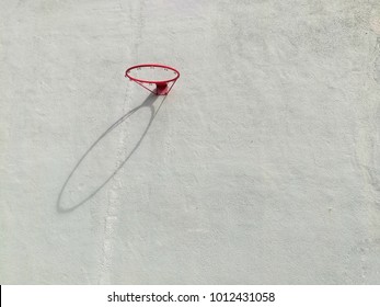 A background of basketball loop with shadow on the cement wall