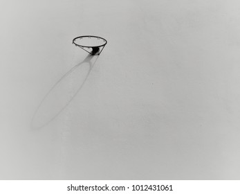 A background of basketball loop with shadow on the cement wall