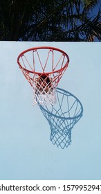 A background of basketball loop with shadow on the cement wall