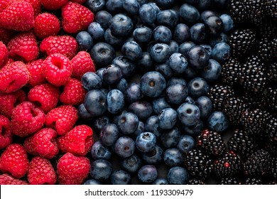 Background Of Berries Of Juicy Blackberries, Raspberries And Blueberries