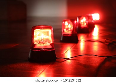 Background with big red flashing alarm lights. - Shutterstock ID 1042134532