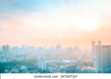 Background of big town concept: Abstract blur aerial view city on twilight color sky and clouds cityscape autumn sunrise. Bangkok, Thailand, Asia