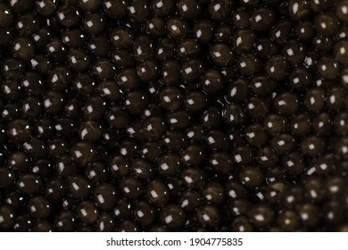 The background of black caviar of premium beluga sturgeon fish.