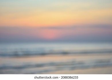 The background was blended with a sunset and an ocean, abstract blurred background