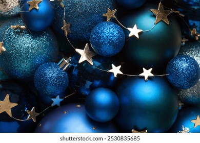 Background with blue Christmas balls and golden stars.
Close-up of a pile of blue Christmas balls, different sizes, shades  and textures. Flat lay - Powered by Shutterstock