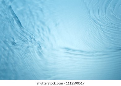 Background of blue clear water in motion with waves - Shutterstock ID 1112590517