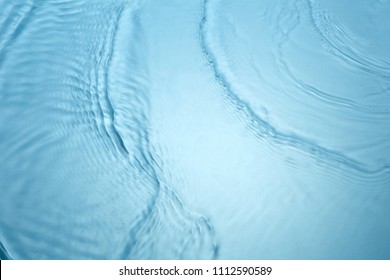 Background of blue clear water in motion with waves - Shutterstock ID 1112590589