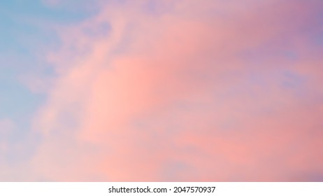 Background of blue sky with pale pink clouds in sunset - Shutterstock ID 2047570937
