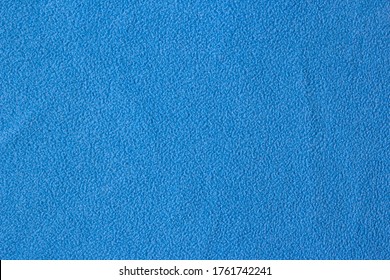 Background Blue Woolen Fabric. Blue flannel fabric texture background simple surface used backdrop or products design. Blue cloth background with fabric texture. Fabric flannel.Place for text.