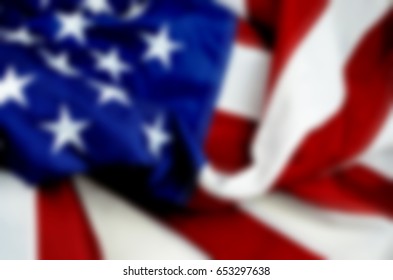 Background Blur Of United States Flag That Is Sewn And Embroidered. Good For All US Holidays Like Fourth Of July, Flag Day, Memorial Day, Labor Day And Presidents Day