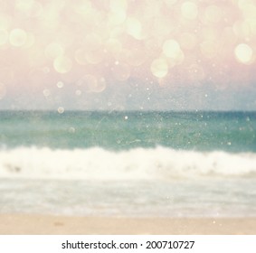 Background Of Blurred Beach And Sea Waves With Bokeh Lights, Vintage Filter. 