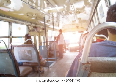 In the background blurred buses.