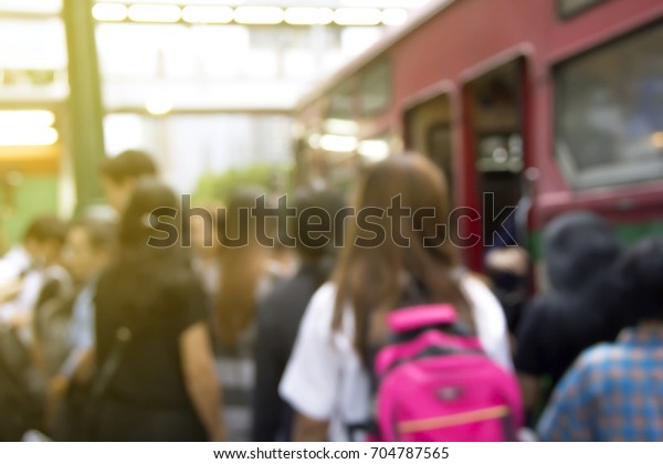 Background Blurred image of People\
Waiting for a bus after work or in rush hour to go home. Are\
everyday life or lifestyle of people in Bangkok,\
Thailand
