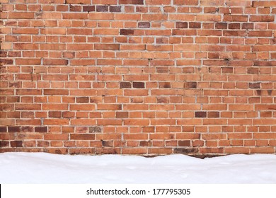 background of brick wall with the snow on the ground - Powered by Shutterstock