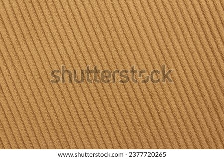 Background of brown soft striped fabric. Fleecy texture