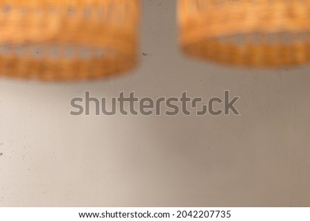Background with brown wicker chandeliers with place for text.