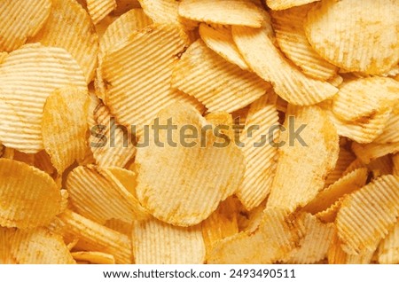 Background of a bunch of ruffled potato chips. 