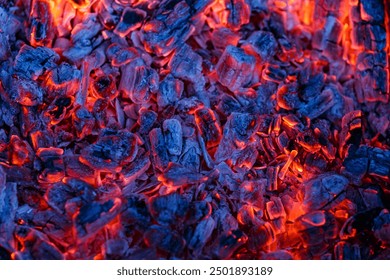 Background of burning and glowing hot coals.Flicker of burning coals at night.The texture of flaming burning firewood.Smoldering embers of fire.  - Powered by Shutterstock