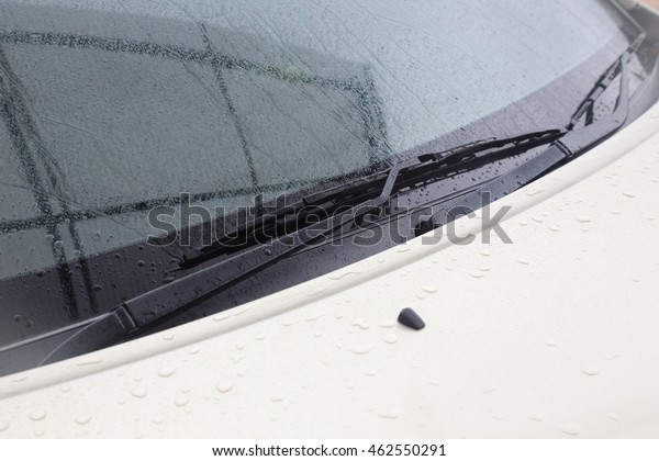 background of car wiper\
blade in a rainy day