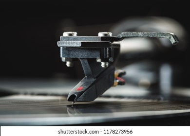 Background cartridge for vinyl records close-up.  Tonearm with pickup head. Copy space. - Shutterstock ID 1178273956