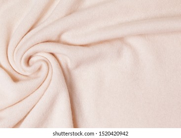 background of cashmere knitwear closeup. Mongolian cashmere cream color.