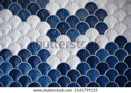 
background of ceramic tiles in shell shape in blue and white