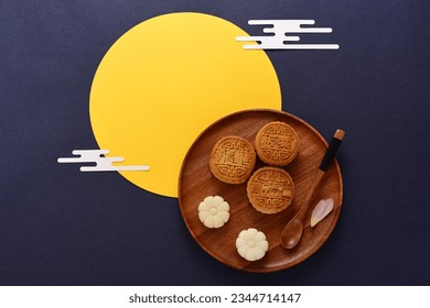 Background of Chinese Traditional Festival Mid-Autumn Festival.The Chinese meaning on the mooncake in the picture is: high-quality five kernels, milk flavored grapes, chestnuts, three flavors. - Shutterstock ID 2344714147