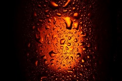 Background. Close Up. Drops On A Glass With An Orange Drink. Beer, Tea