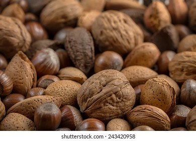 background with closeup of bunch of nuts (shallow DOF)