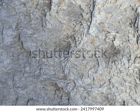 Background close-up of gray boulder. Textured natural trend popular colorful background. Gray grunge banner. Stone texture background.