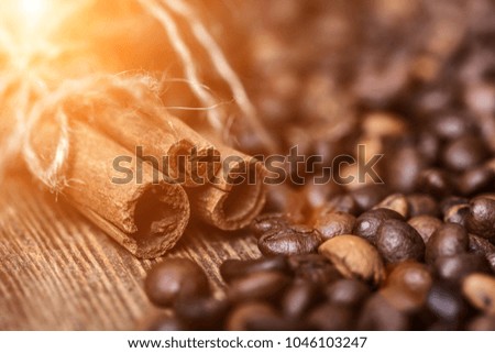 Background of coffee. fried coffee beans with sunlight. coffee beans, on a wooden background