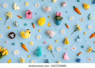 Background collection of Easter objects arranged on a blue background, overhead view - Powered by Shutterstock