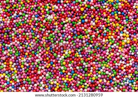 Background of colored balls. The texture is a lot of different color balls. Many  spheres of different sizes.