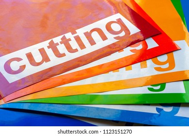 Background of colored pieces of vinyl film with the inscription "Cutting"