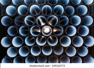 background of colorful big plastic pipes used at the building site.