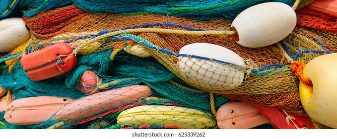 background of colorful fishing nets and floats - Powered by Shutterstock