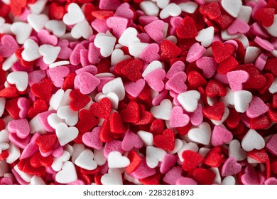 background of confectionery sprinkles in the form of hearts