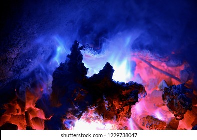 Background Consisting Of A Turquoise Flame From Burning Magnesium On A Hot Coal Anthracite.