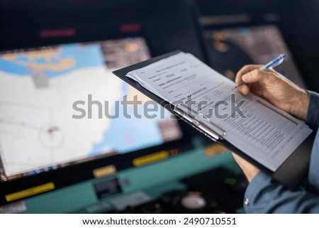 Background control panel of ship staff with file in hand