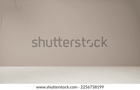 Background for a cosmetic, fragrance or beverage product packshot - brown plaster wall and white marble table in the foreground