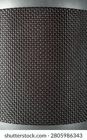 Background created with a close-up of gray speaker grille fabric. Music sound concept.