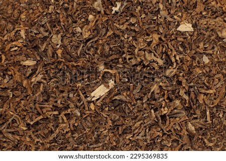 Background of crushed dry tobacco leaves